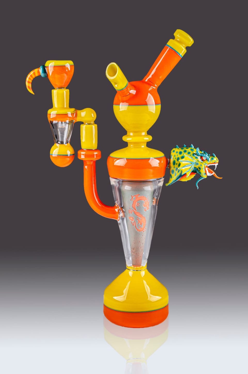 Orange and yellow glass rig by Robert Mickelsen with a clear cone chamber, a curled horn and a spotted lizard climbing the side