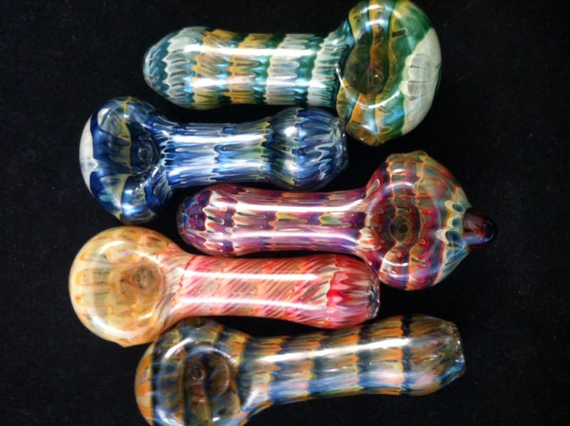 Five hand pipes worked with latticino cane in blue, teal, pink and amber