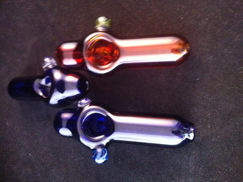 Three hand pipes in red, blue and purple with tapered stems