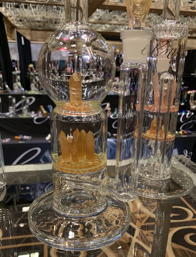 A tall clear water pipe with a dome percolator and a fritted disc