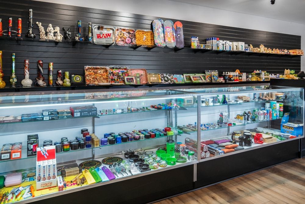 Accessory wall with rolling papers, trays and grinders