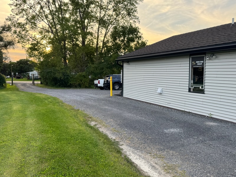 The drive-thru lane at Dryden Dispensary, running alongside the building to the pick-up window