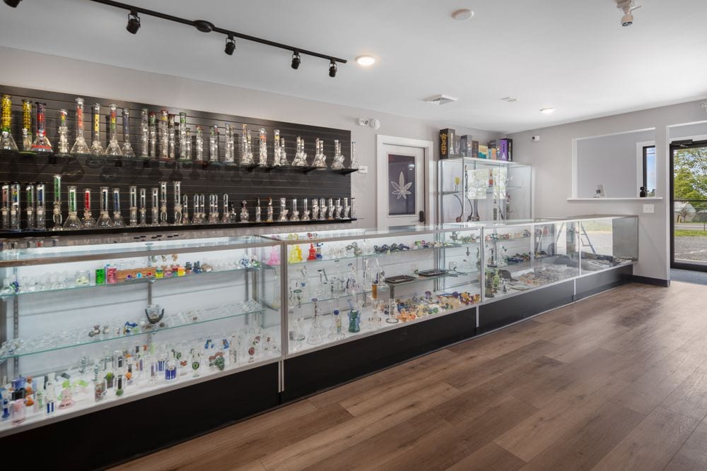 Display cases of glass and accessories at Dryden Dispensary
